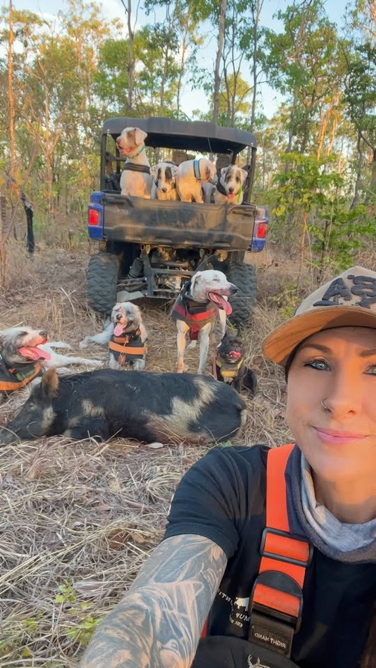 Bianca selfie with her pack of hunting dogs after a successful morning