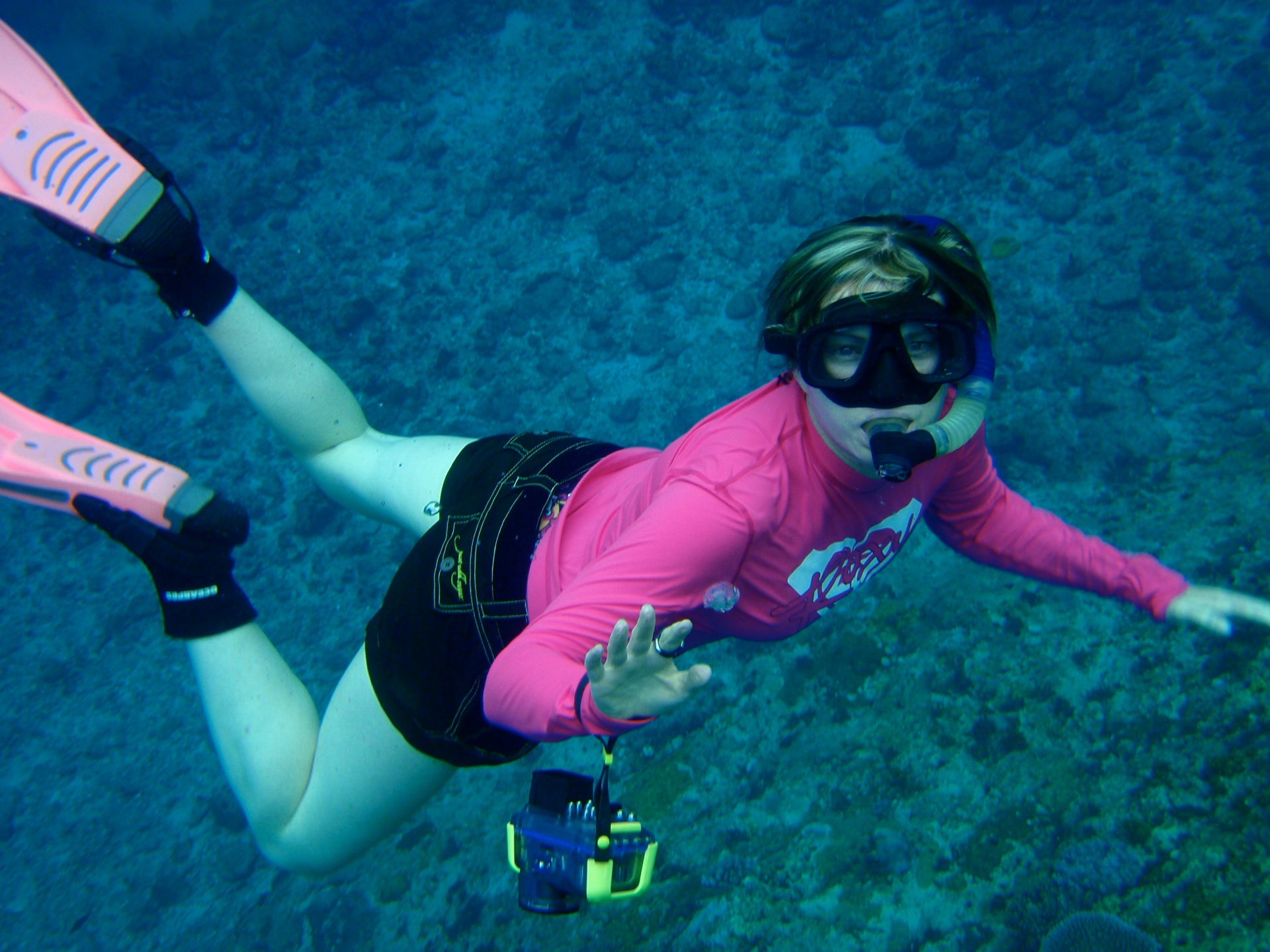 Emma snorkelling above a reef
