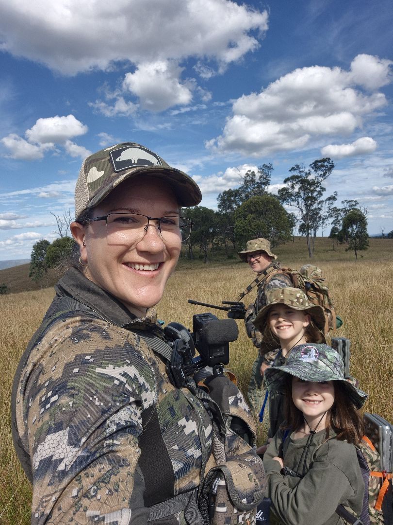 Kate and Brett with daughters Amelia and Quinn in golden Australian bush grass