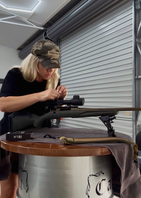 Emma working on her new Ruger rifle setup in the workshop